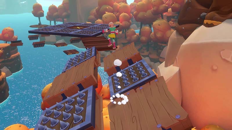 Gameplay interface view showing environmental hazards and collectible energy orbs across islands