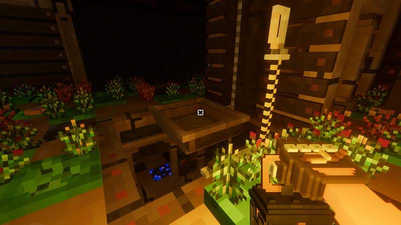 Gameplay scene showing a dark cavern illuminated by lanterns or portable lighting