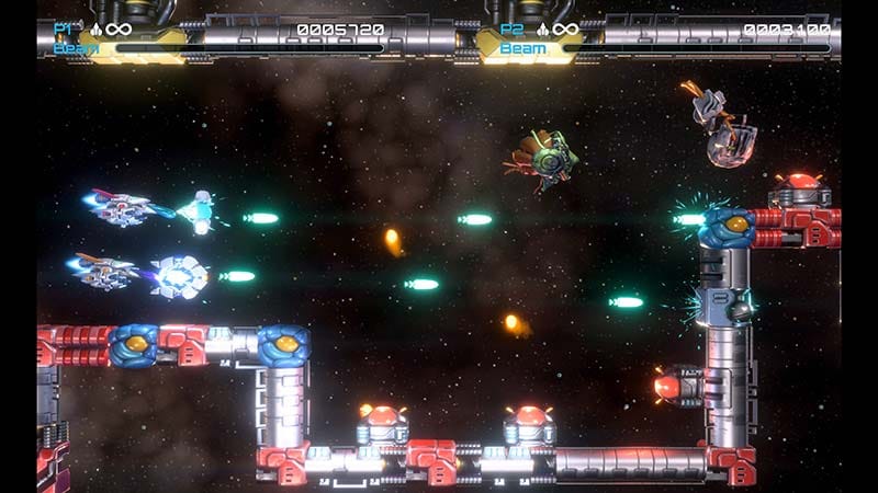 Side-scrolling gameplay showing R-90 navigating hazardous alien formations