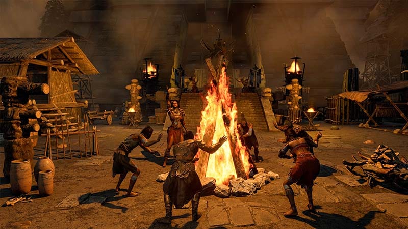 Gameplay screenshot showing a settlement and tribal characters