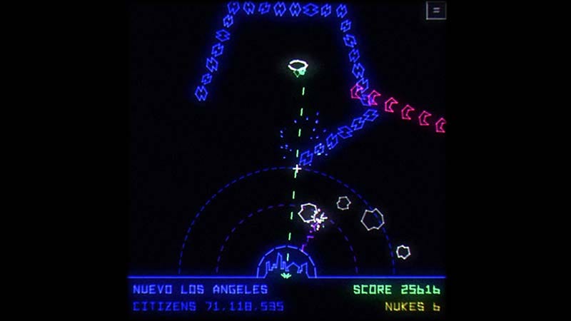Gameplay scene showing a city defending against hostile alien enemies