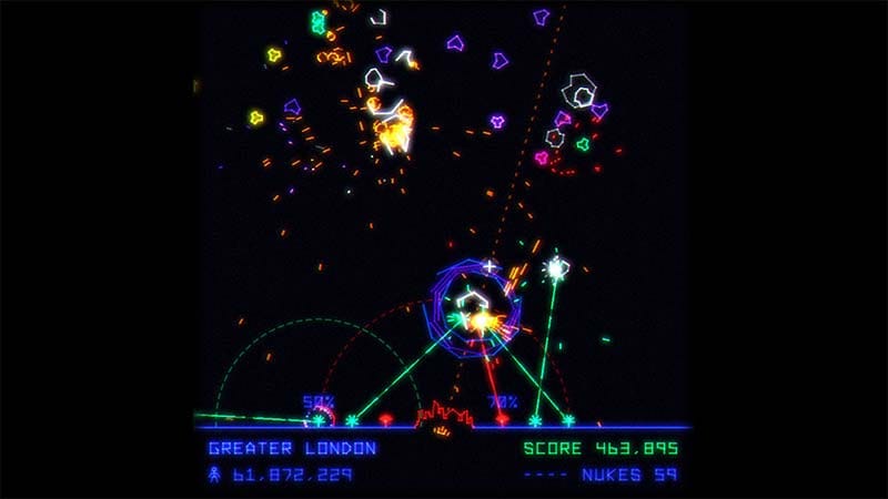 Gameplay view featuring a futuristic city and surrounding alien attack waves